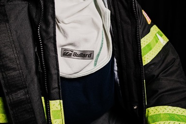 Firemen opening fire truck side panel