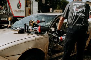 Firemen opening fire truck side panel